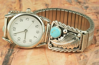 Genuine Sleeping Beauty Turquoise set in Sterling Silver Watch Tips. Sterling Silver Leaf Design. Mens Watch with expandable band. Created by Navajo Artist Thomas Chischilly. Signed.